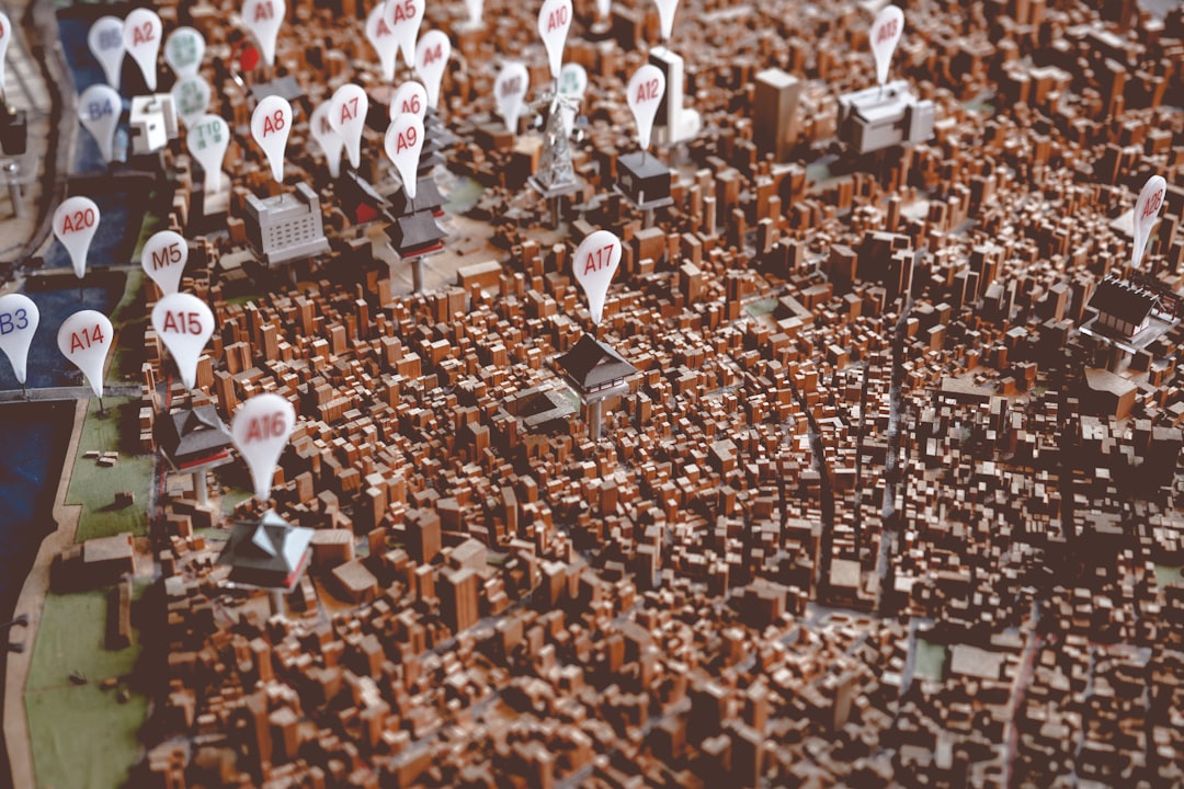 A 3D map of a city — the same business plotted as a ranked position and as a resolvable entity at the same time