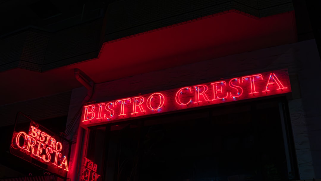 A bistro storefront lit at night — a business whose single most-asked fact is whether it is open right now