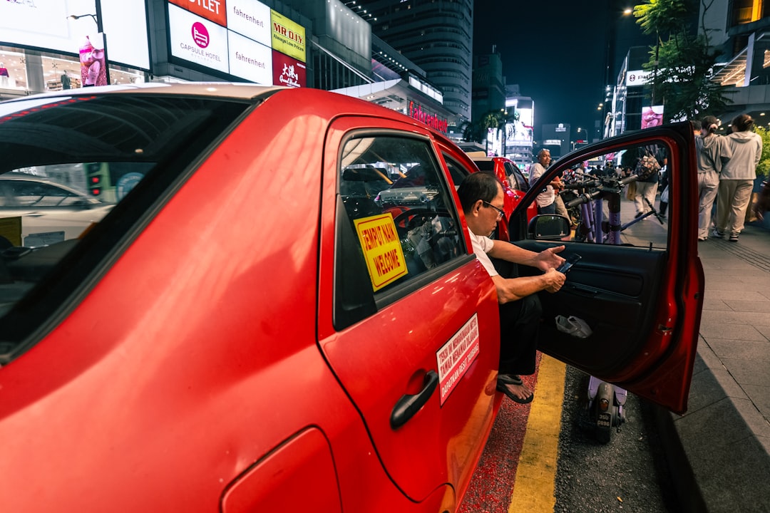A person stepping into a taxi at night — the moment a time-sensitive local question gets handed to an assistant