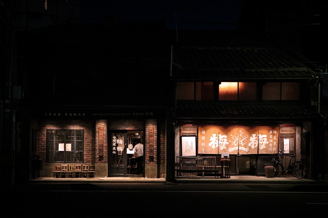 A small storefront at night, the kind of entity an AI assistant has to compress into a schema record